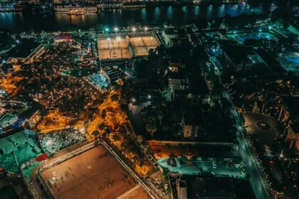 Nile River and Cairo Tower at night with colourful lighting and a bridge over the river