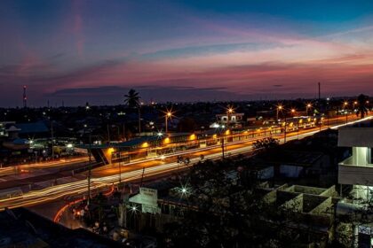 Illuminated infrastructure of Dar es Salaam with residential buildings and roads.