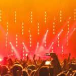 A view of a vibrant nightclub in Sharm El Sheikh with neon lights and dancing crowds.