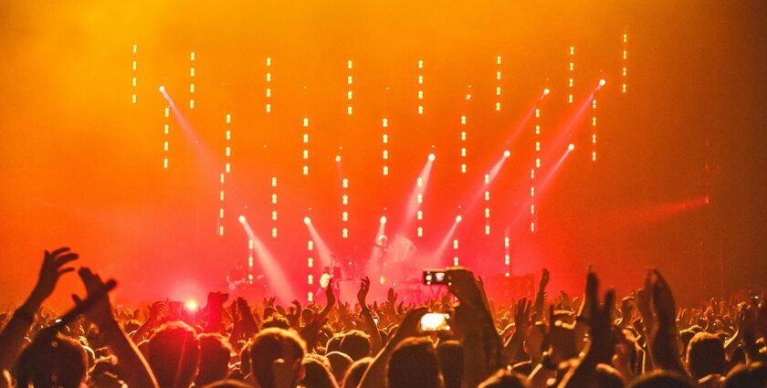 A view of a vibrant nightclub in Sharm El Sheikh with neon lights and dancing crowds.