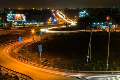 Kenya's super highway at night with lit roads and advertisements on the billboards