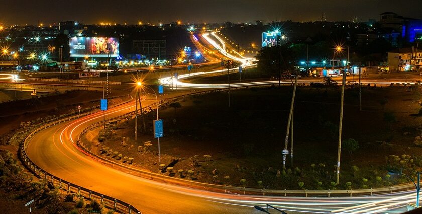 Kenya's super highway at night with lit roads and advertisements on the billboards