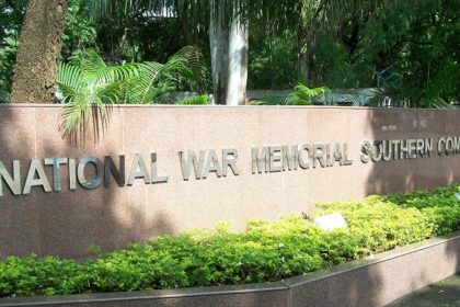 Image of the entrance of National War Museum Pune with lush green trees in the background