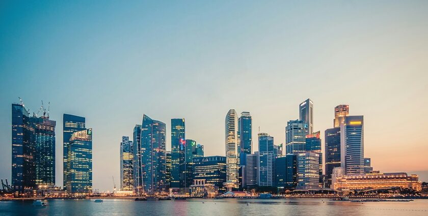 The official mascot of Singapore, is a lion, with tall skyscrapers in the background.