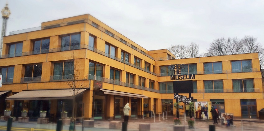 An image showing the exterior of the ABBA Museum, featuring its modern architecture.