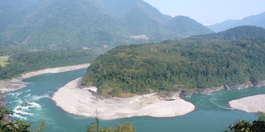 River Siyom flowing through Aalo, Arunachal Pradesh, with surrounding hills.
