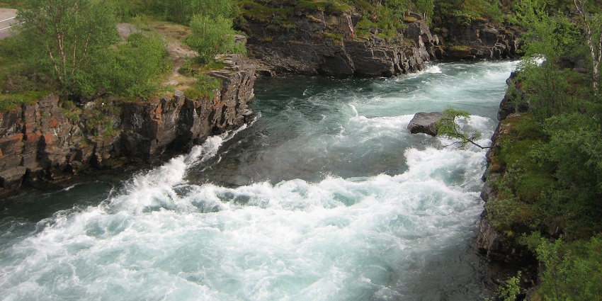 An image showing the dramatic canyon of Abiskojåkka River, a popular destination near Abisko National Park