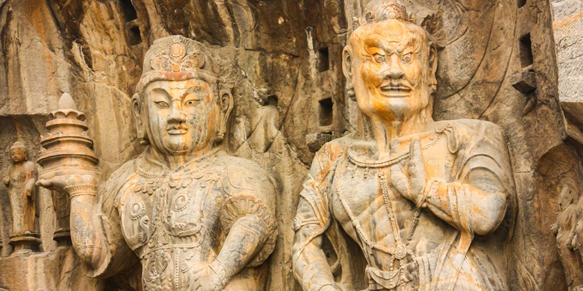 Glimpse of two unique statues in Longmen Caves.