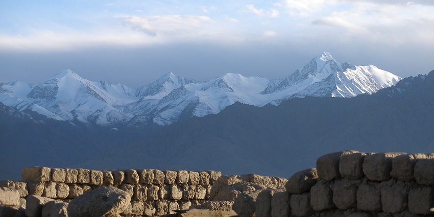 Enjoy views of the majestic snow-clad mountains while paragliding in Leh, Ladakh