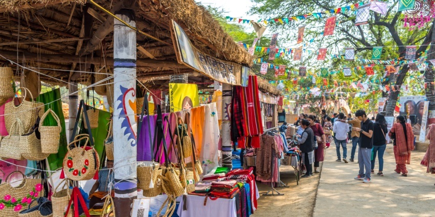 A view of the Surajkund mela with traditional crafts displayed for travellers to explore.