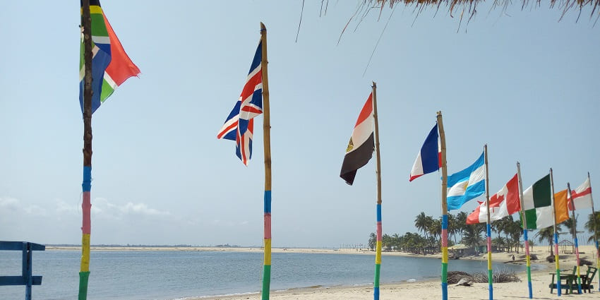 Different countries’ flags on the Maranatha Beach Resort in Ada Foah, Ghana