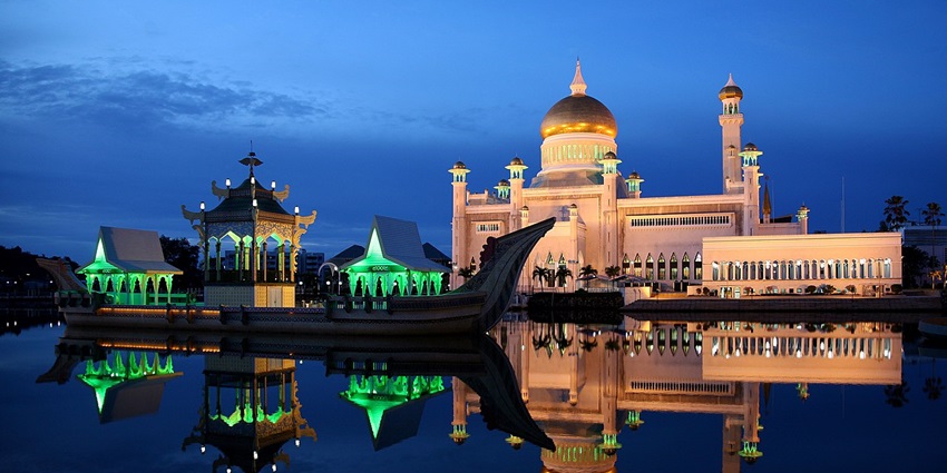 A beautiful night view of the landmark Omar Ali Saifuddien Mosque - among things to do in Brunei