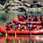 People enjoying river rafting in Rishikesh, one of the best adventure sports in india.