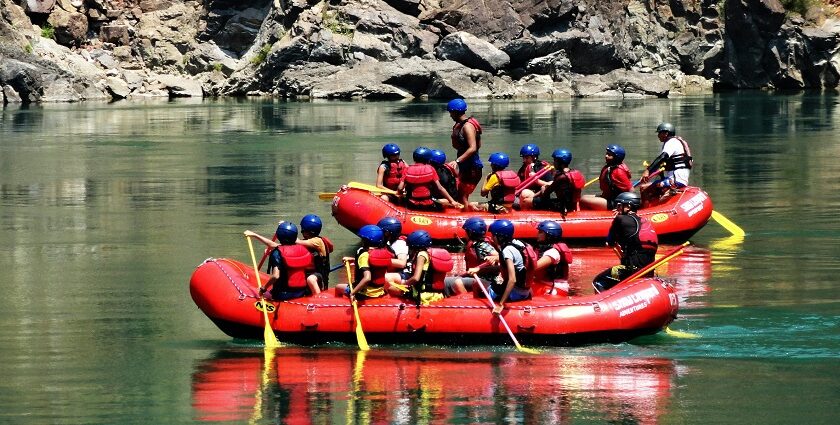 People enjoying river rafting in Rishikesh, one of the best adventure sports in india.