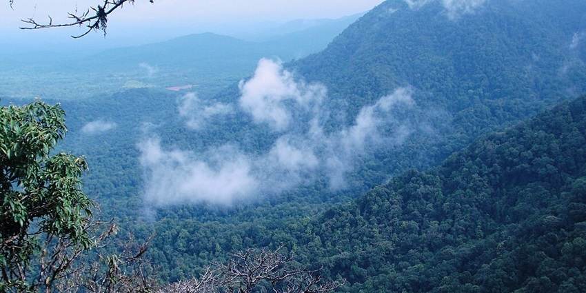 An image showing Agumbe View Point in Karnataka, overlooking valleys and distant mountain ranges
