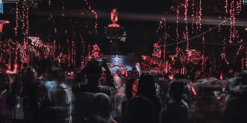 An image of a night scene with numerous lights, a crowd, during Christmas in Aizawl, one of the popular places to visit in Christmas India.