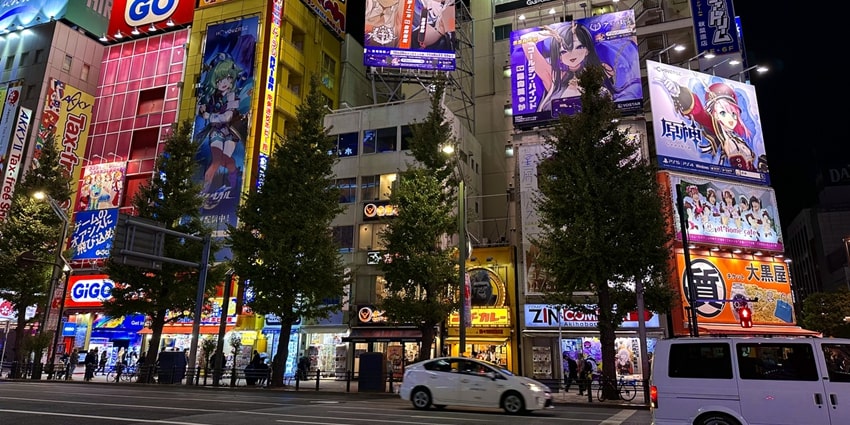 Bright lights and colorful anime ads line the busy streets of Akihabara, Tokyo