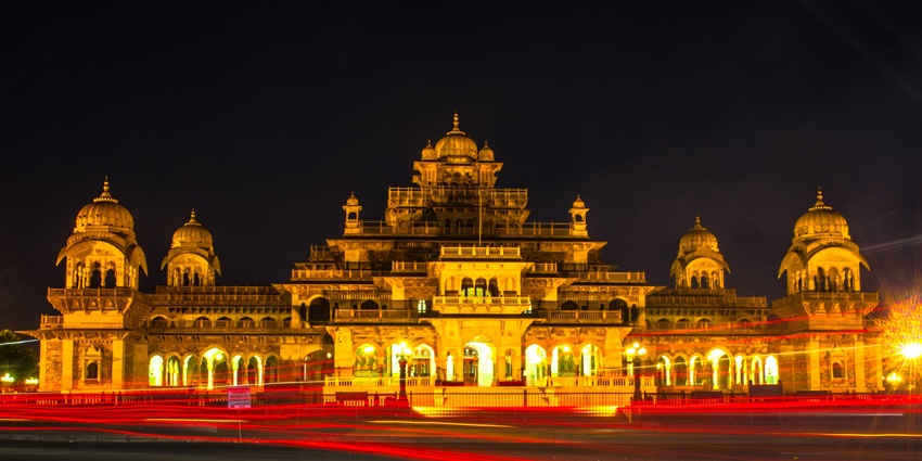 An image showing the Albert Hall Museum at night, illuminated with lights highlighting its structure