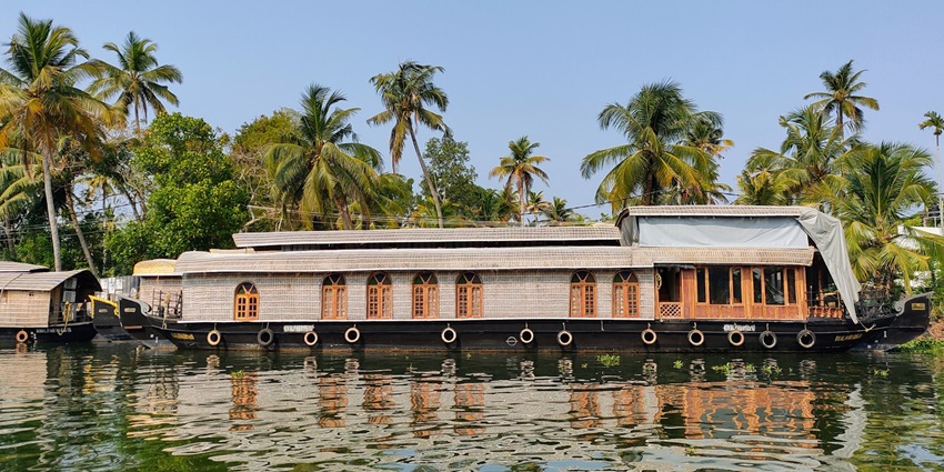 An image of a houseboat in Alleppey, one of the places to create memorable experiences.