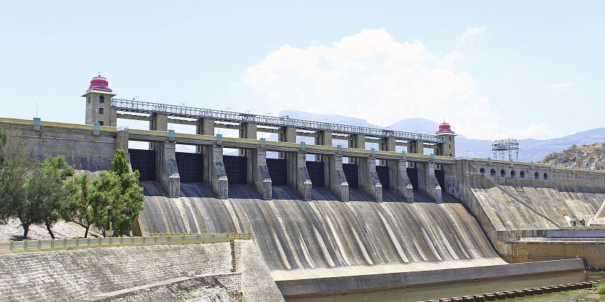 A huge dam at Amaravathi Reservoir with nine floodgates is used to release water.