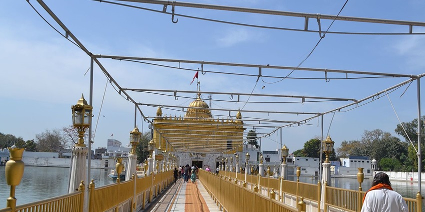 An image of the bridge to the Durgiana Temple in Amritsar, one of the best places to visit in April.