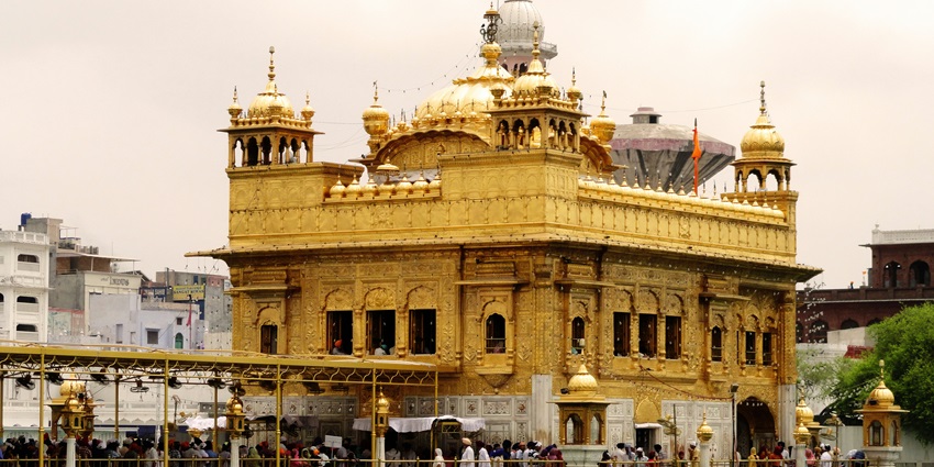 An image of the Golden Temple in Amritsar, beautifully lit at night, reflecting in the sacred water.