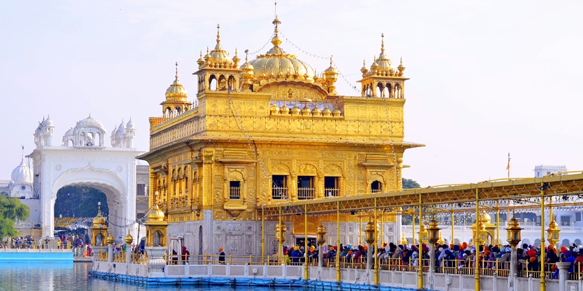 Golden Temple reflecting in the holy water, one of the places to visit in North India in December.