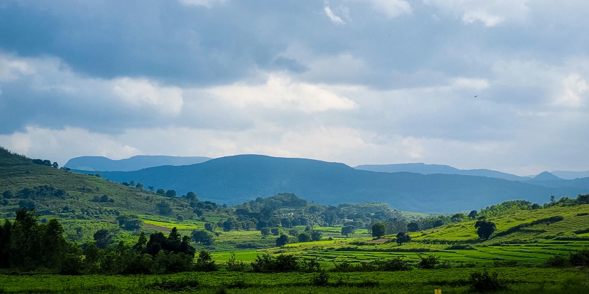Araku Valley with dense green hills, scenic landscapes, and a soothing atmosphere.