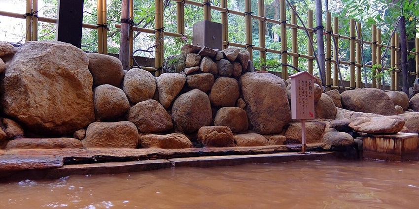 A picturesque scene of Arima Onsen, showcasing its historic bathhouses and soothing waters