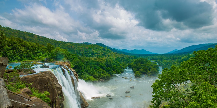 An image showing the famous waterfall of Athirapally Falls during the monsoon season