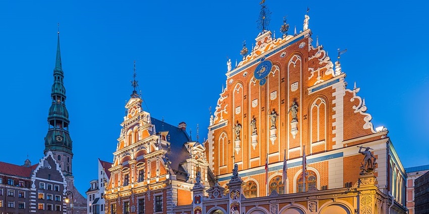 House of Blackheads and St. Peter's Church Tower at dusk, Riga, Latvia