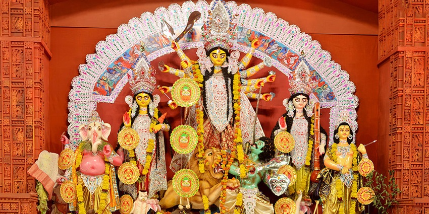 Image of Durga puja pandal with decorations and vibrant lights that mersmerie everything