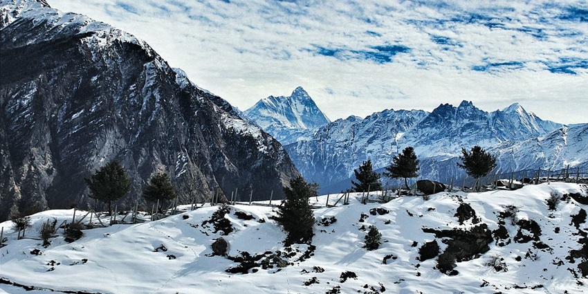 Places to visit Uttarakhand in August feature snow-capped mountains.