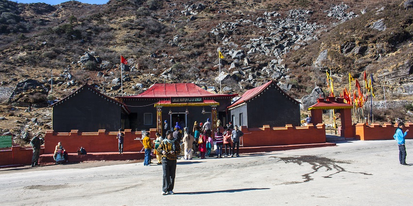 Devotees visiting Baba Harbhajan Singh Mandir near Tsomgo for spiritual comfort.