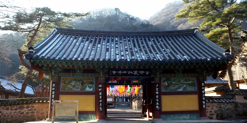 Serene Buddhist temple surrounded by mountains and nature in Jeollanam-do.