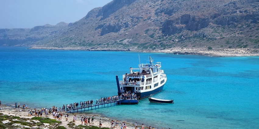 unboarding in Balos Beach from ferryboat being a step ahead and off ant track
