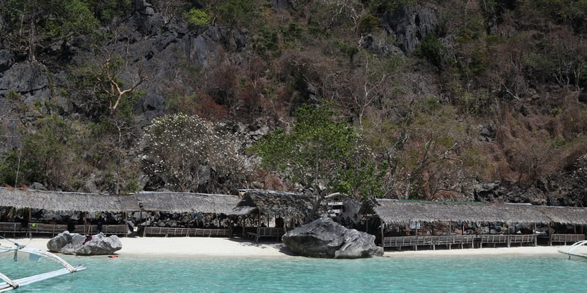 Banul Beach is among the best beaches in Palawan with turquoise waters and stunning limestone cliffs.