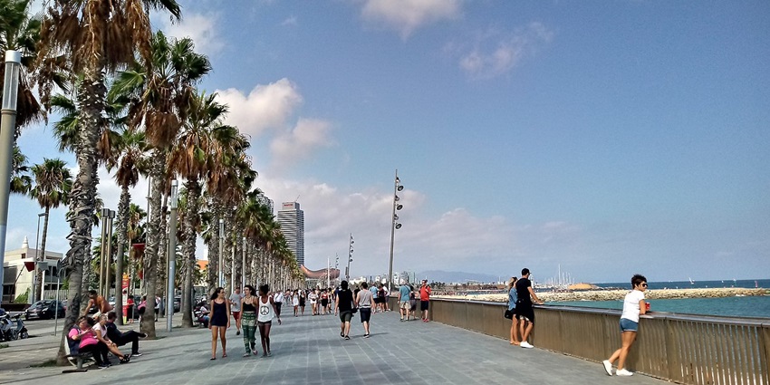 Tourists enjoying Barceloneta Beach, a blend of excitement and peace.