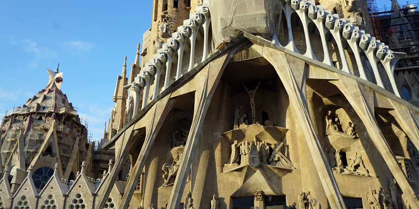 A towering view of the Basilica of the Sagrada Familia in Barcelona, Spain.
