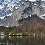 An image showing the stunning Königssee in Berchtesgaden National Park, Germany, surrounded by mountains.