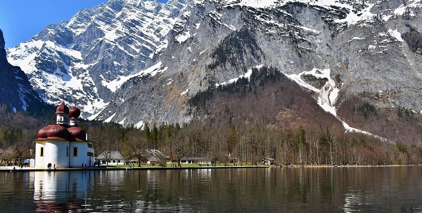 An image showing the stunning Königssee in Berchtesgaden National Park, Germany, surrounded by mountains.