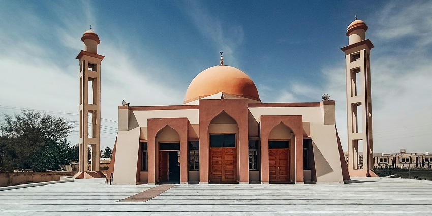 A typical structure of mosque with a dome and two minarets is looking heavenly in daylight