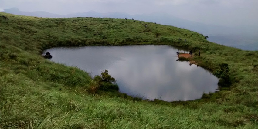Image of the Heart shaped Lake in Kerala, beautifully covered in mist during monsoon