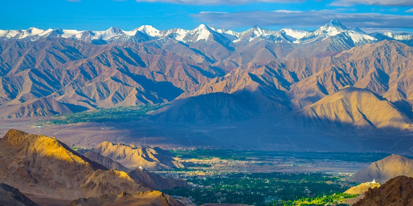 An image of Leh City with Stok Kangri in the background, highlighting the rugged landscape