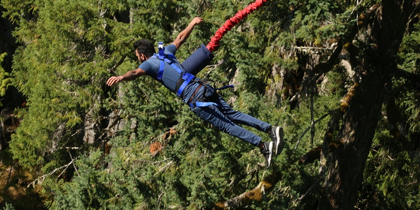Snapshot of a man taking a Bungee jumping from a certain height of a Platform
