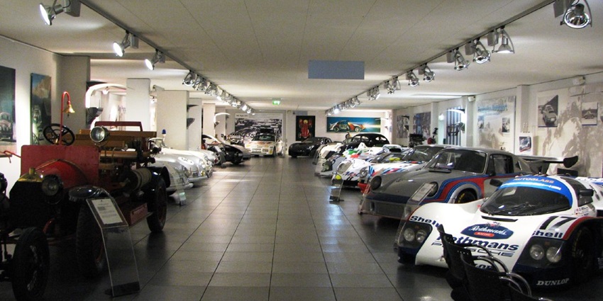 An image showing the old Porsche Museum at Porscheplatz 1, Stuttgart, with classic displays.