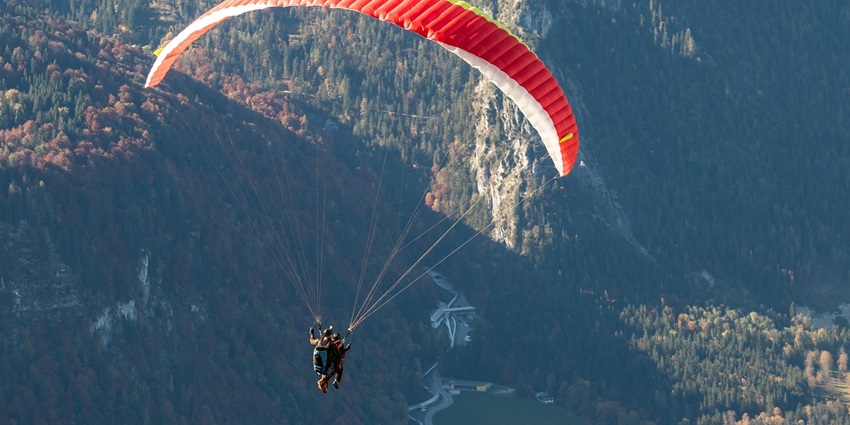 An image showing a person engaged in skydiving with a parachute, similar to indoor skydiving in India.