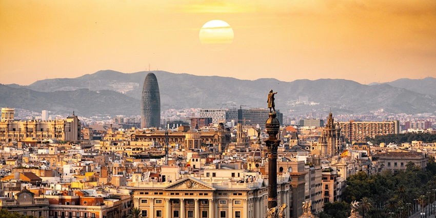 Stunning sunset view of Barcelona city showcasing a blend of historic charm with modern architecture.