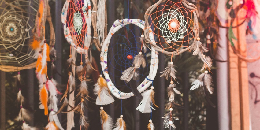 Handmade and beautifully decorated dream catchers hanging in a shop in Gujarat, Ahmedabad.