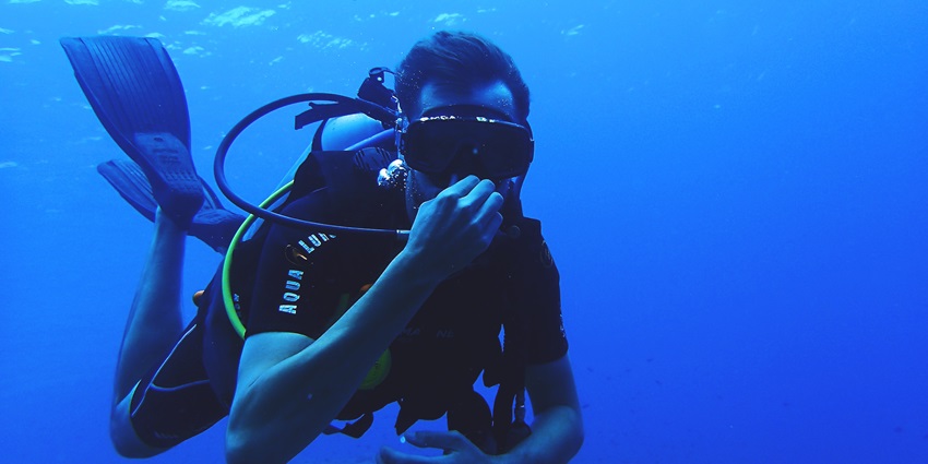 Bahamas snorkelling features crystal clear waters and ancient underwater rock formation.